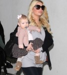 A Pregnant Jessica Simpson Arriving On A Flight At LAX With Her Family