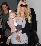 A Pregnant Jessica Simpson Arriving On A Flight At LAX With Her Family