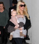 A Pregnant Jessica Simpson Arriving On A Flight At LAX With Her Family