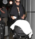 Molly Sims and Son Brooks Arrive at LAX