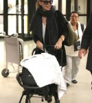 Molly Sims and Son Brooks Arrive at LAX