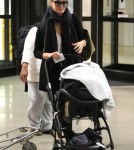 Molly Sims and Son Brooks Arrive at LAX