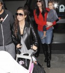 Khloe & Kourtney Kardashian Land At LAX