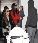 Khloe & Kourtney Kardashian Land At LAX