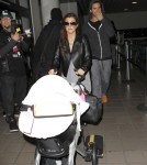 Khloe & Kourtney Kardashian Land At LAX