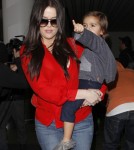 Khloe & Kourtney Kardashian Land At LAX