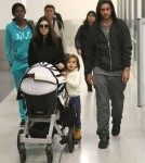 Kourtney Kardashian And Family Arriving On A Flight At LAX