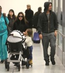Kourtney Kardashian And Family Arriving On A Flight At LAX
