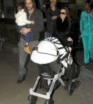Kourtney Kardashian And Family Arriving On A Flight At LAX
