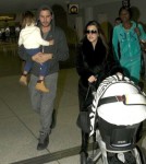 Kourtney Kardashian And Family Arriving On A Flight At LAX
