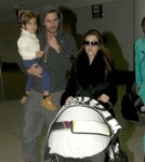 Kourtney Kardashian And Family Arriving On A Flight At LAX