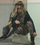 Exclusive... Pregnant Fergie Touches Down In Paris