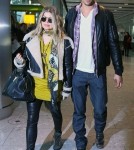 Pregnant Fergie & Josh Land In London