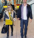 Pregnant Fergie & Josh Land In London