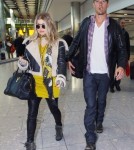 Pregnant Fergie & Josh Land In London