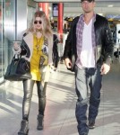 Pregnant Fergie & Josh Land In London
