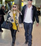 Pregnant Fergie & Josh Land In London