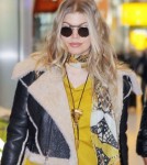 Pregnant Fergie & Josh Land In London