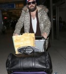 Shy Adele And Family Departing On A Flight At LAX