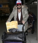 Shy Adele And Family Departing On A Flight At LAX