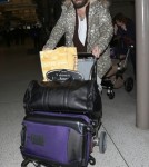 Shy Adele And Family Departing On A Flight At LAX