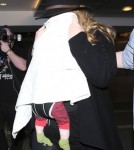Shy Adele And Family Departing On A Flight At LAX