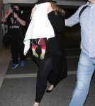 Shy Adele And Family Departing On A Flight At LAX