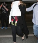 Shy Adele And Family Departing On A Flight At LAX