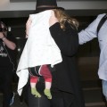 Shy Adele And Family Departing On A Flight At LAX
