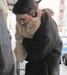 Katie Holmes Struggles to Pick Up Growing Suri