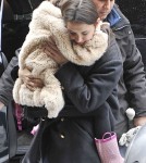 Katie Holmes Struggles to Pick Up Growing Suri