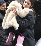 Katie Holmes Struggles to Pick Up Growing Suri
