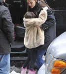 Katie Holmes Struggles to Pick Up Growing Suri