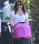 Alyson Hannigan And Her Husband Take Their Daughter For A Stroll