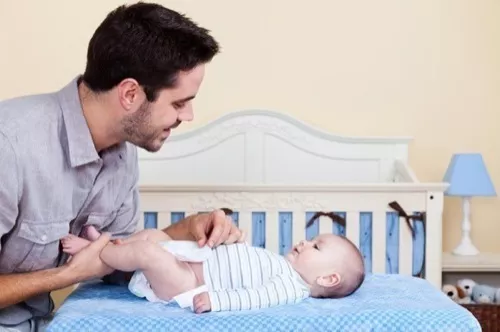 dad-changing-baby-boys-diaper