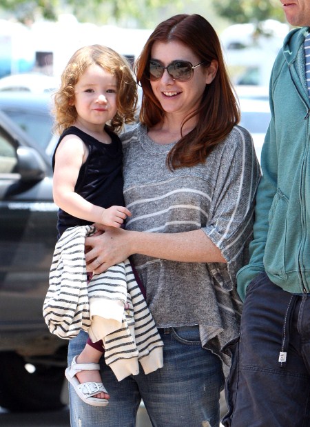 Alyson Hannigan grocery shops with her family at Ralphs in Malibu, Ca on August 13, 2011.