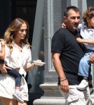 Jennifer Lopez carries her children Max and Emme around the set of her new music