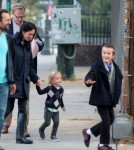 Jennifer Connely and Paul Bettany take a walk with a friend and their three children, Kai, Stellan and Agnes Lark