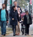 Jennifer Connely and Paul Bettany take a walk with a friend and their three children, Kai, Stellan and Agnes Lark