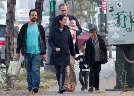 Jennifer Connely and Paul Bettany take a walk with a friend and their three children, Kai, Stellan and Agnes Lark