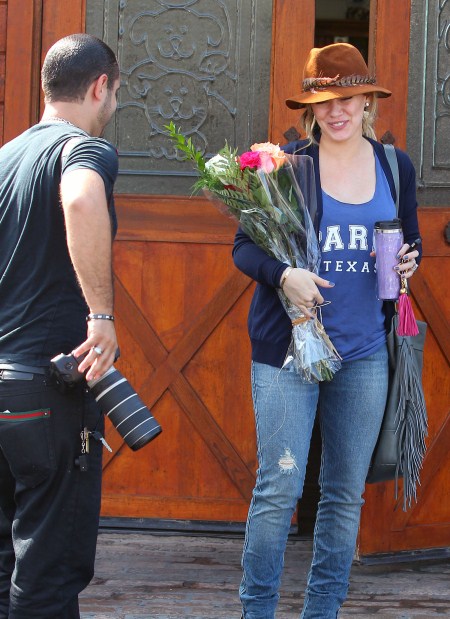 Actress Hilary Duff gets flowers from paparazzo in Los Angles, Ca for her Birthday on September 28, 2011.