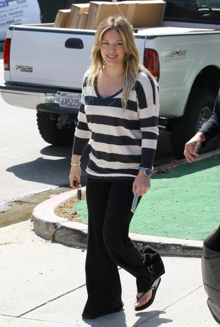 Pregnant Hilary Duff cuts some flowers with her faithful dog at her side then goes to her morning Pilates class in Toluca Lake, California on September 20, 2011.