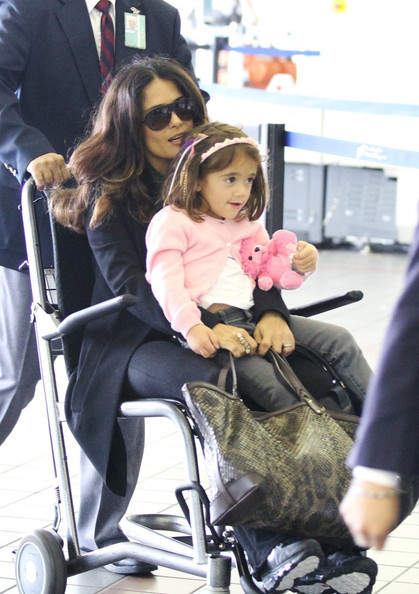 Salma Hayek and daughter Valentina are escorted to their departure gate in a wheelchair at LAX
