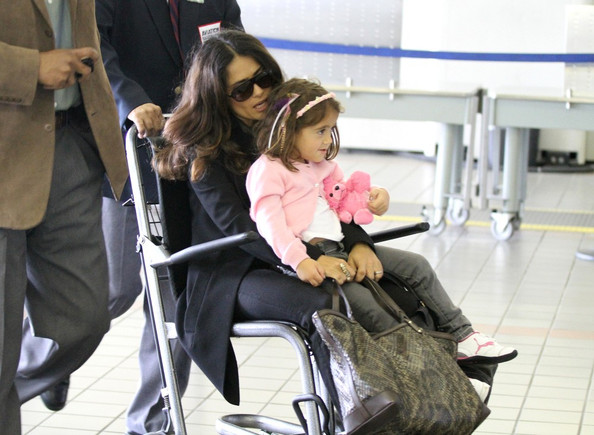 Salma Hayek and daughter Valentina are escorted to their departure gate in a wheelchair at LAX