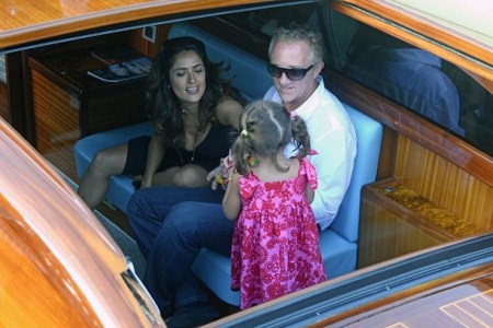 Salma Hayek and Francois-Henri Pinault with their daughter Valentina in piazza San Marco, Venice.