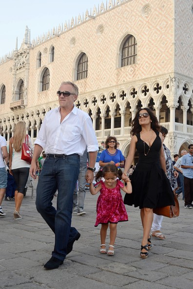 ss Salma Hayek and Francois-Henri Pinault with their daughter Valentina in piazza San Marco, Venice.