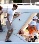 Leonardo DiCaprio, Tobey Maguire and wife Jennifer Meyer, and their daughter Ruby On a Boat