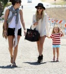 Nicole Richie hits the beach in Malibu, CA on September 3, 2011 with daughter Harlow Madden