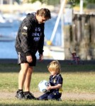Russell Crowe kicks a soccer ball around with youngest son Tennyson