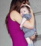 Victoria Beckham holds Harper close as she leaves the Plaza Hotel in New York City after having lunch.